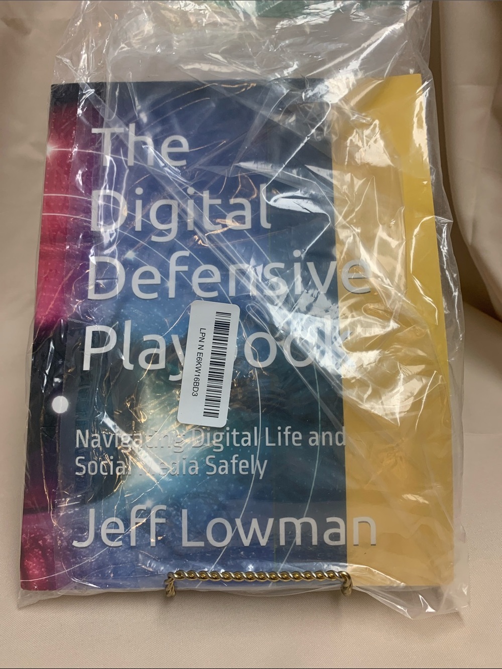 The Digital Defensive Playbook by Jeff Lowman - Blue & Yellow Cover